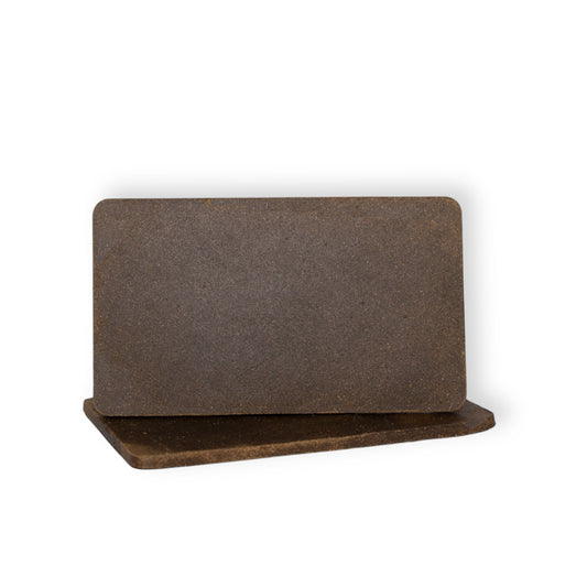 A slab of Delta-8 THC Moroccan brick hash cut open, revealing its rich, resinous interior and terpene-packed structure for a smooth, flavorful smoking experience.