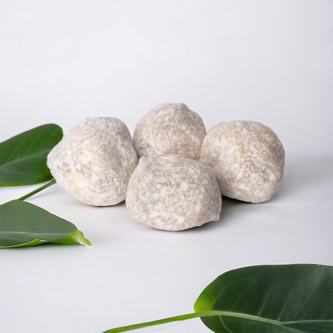 Close-up of Hurcann Delta-8 THC Ice Caps, showcasing heavily coated hemp buds covered in a thick layer of Delta-8 distillate and premium kief for maximum potency.
