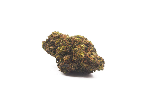Close-up of Legendary OG CBD flower, featuring dense, frosty buds with deep green and purple hues, covered in resinous trichomes for a potent, relaxing experience.