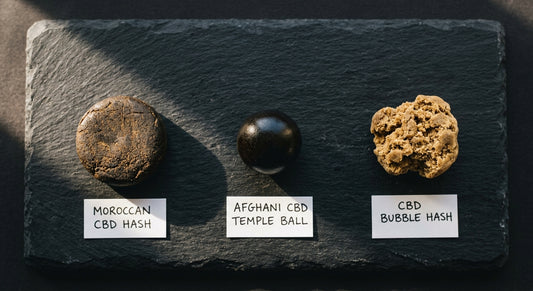 1 gram of hash varieties including Moroccan pressed bubble hash and Afghani temple ball on white surface