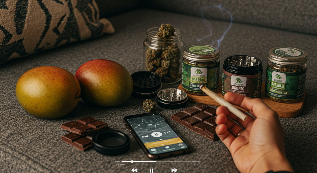 A person on a couch with a joint, mangos, chocolate, a grinder, cannabis jars, and a playlist.