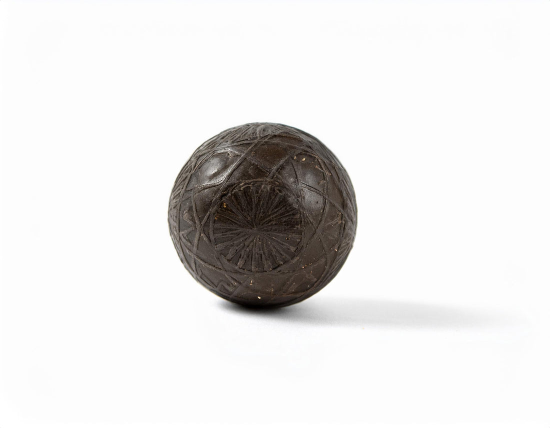 afghan temple ball with designs carved