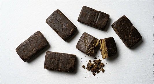Afghanistan hash dark brown slabs broken open showing interior texture Hurcann