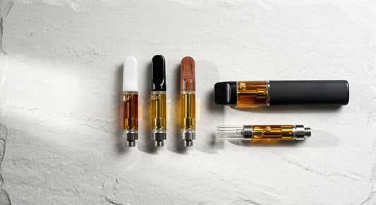 best THCA vapes 2026 live resin cartridges and disposables on white surface