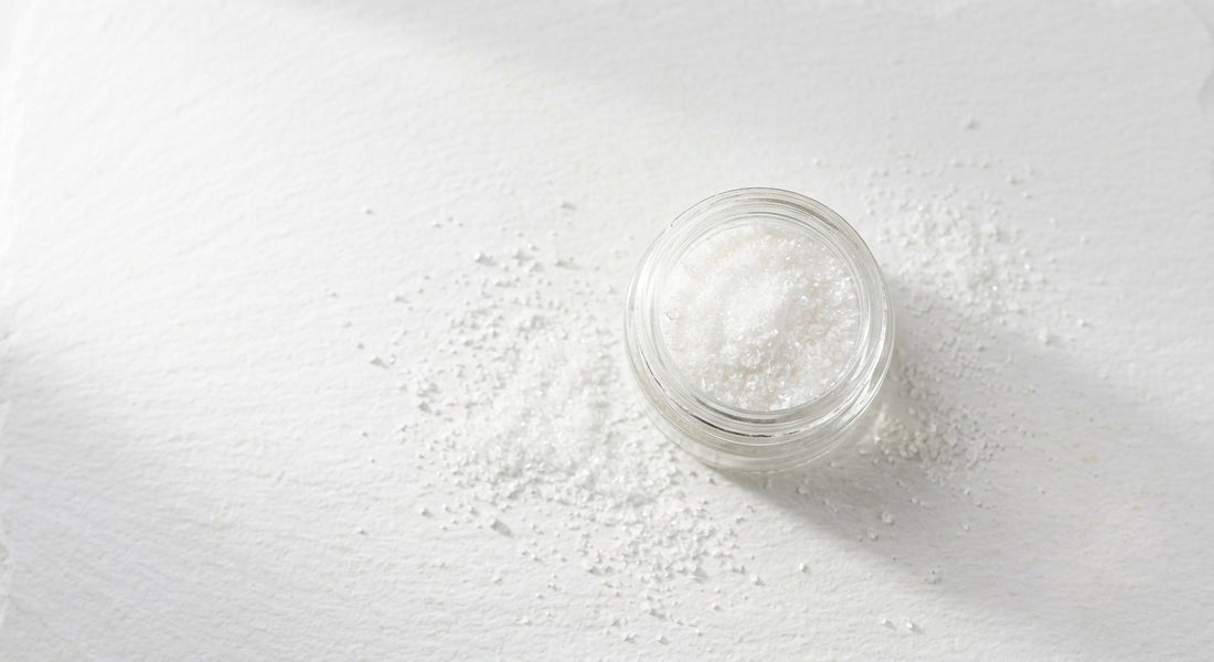 cbd crystalline for sale fine white isolate powder in glass jar on white surface wholesale