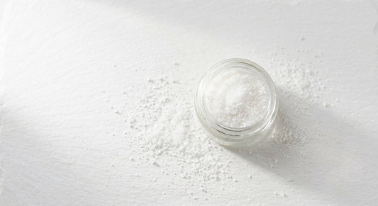 cbd crystalline for sale fine white isolate powder in glass jar on white surface wholesale