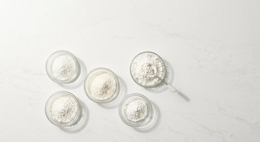 CBD isolate pricing 2026 fine white powder bulk wholesale in glass dishes