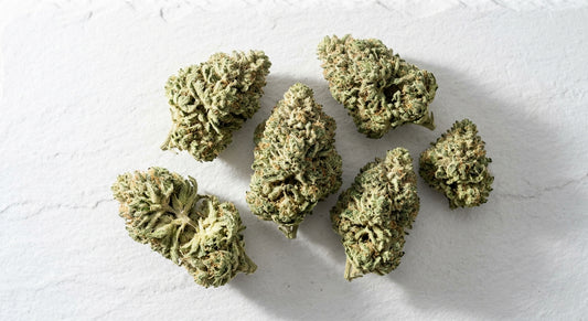 CBG flower benefits dense pale green hemp buds flat lay Hurcann 2026