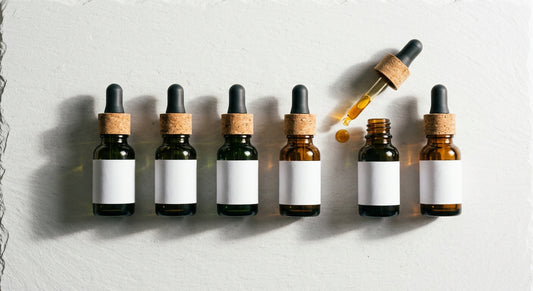 cbg oil vs cbd oil dropper bottles side by side comparison flat lay Hurcann