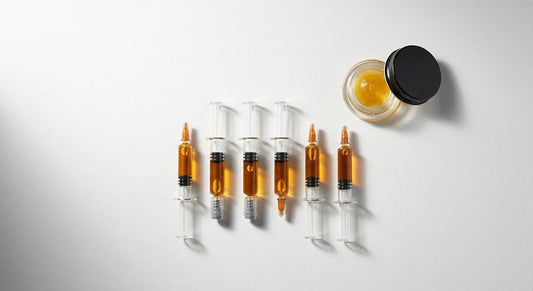 delta 8 distillate vs delta 9 THC amber concentrate syringes flat lay comparison