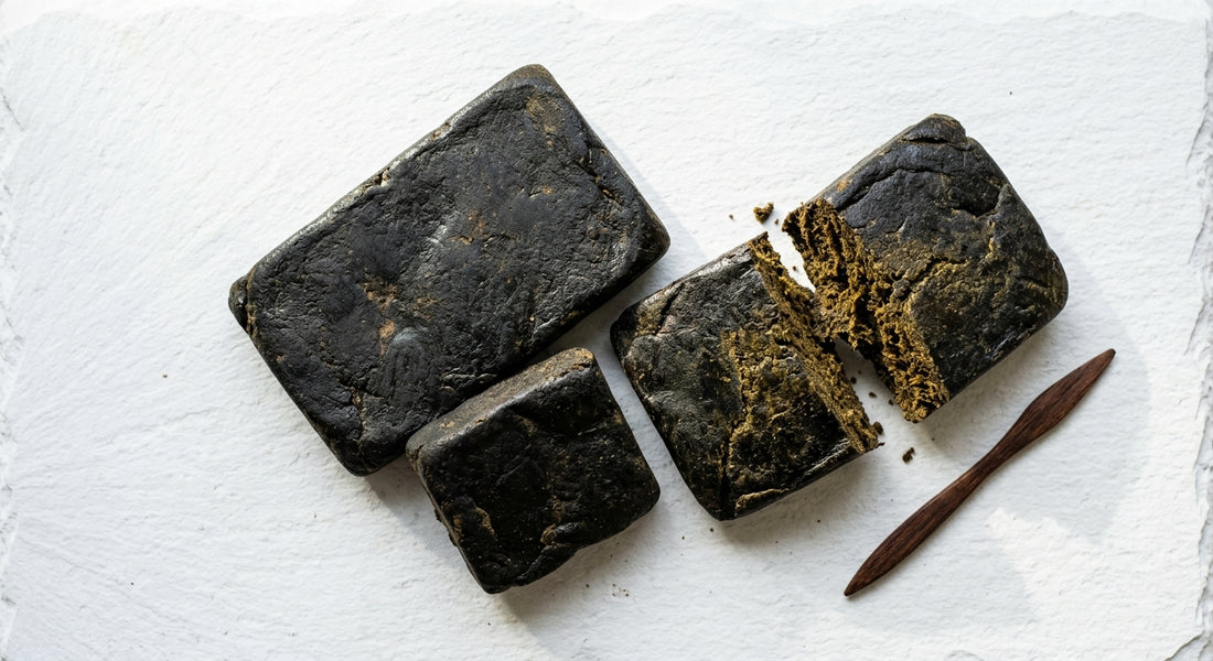 egyptian hash dark slabs flat lay showing near-black resin concentrate texture 2026