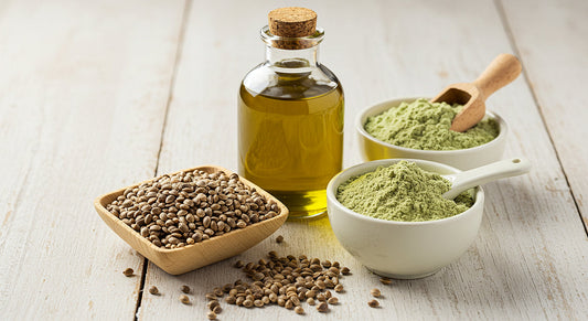 A selection of hemp-based products, including seeds, oil, and protein powder, arranged on a wooden surface.