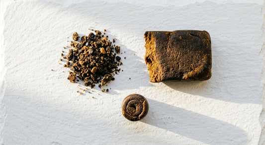 how to use CBD hash different forms crumbled slab and rolled pieces on white surface