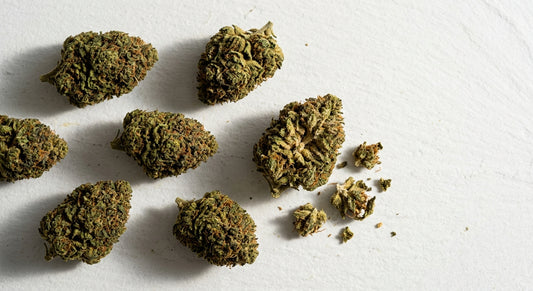 is hemp flower legal 2026 dense CBD hemp flower buds flat lay Hurcann