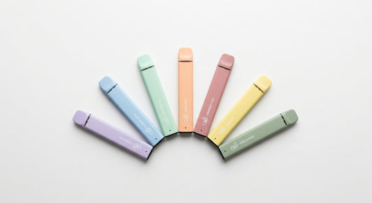 puff CBD en gros wholesale disposable vape bars arranged on white surface Hurcann
