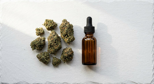 THC vs CBD hemp flower buds and CBD oil dropper comparison flat lay Hurcann