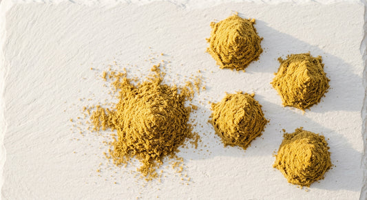 THCA kief bulk golden powder on white surface wholesale hemp product