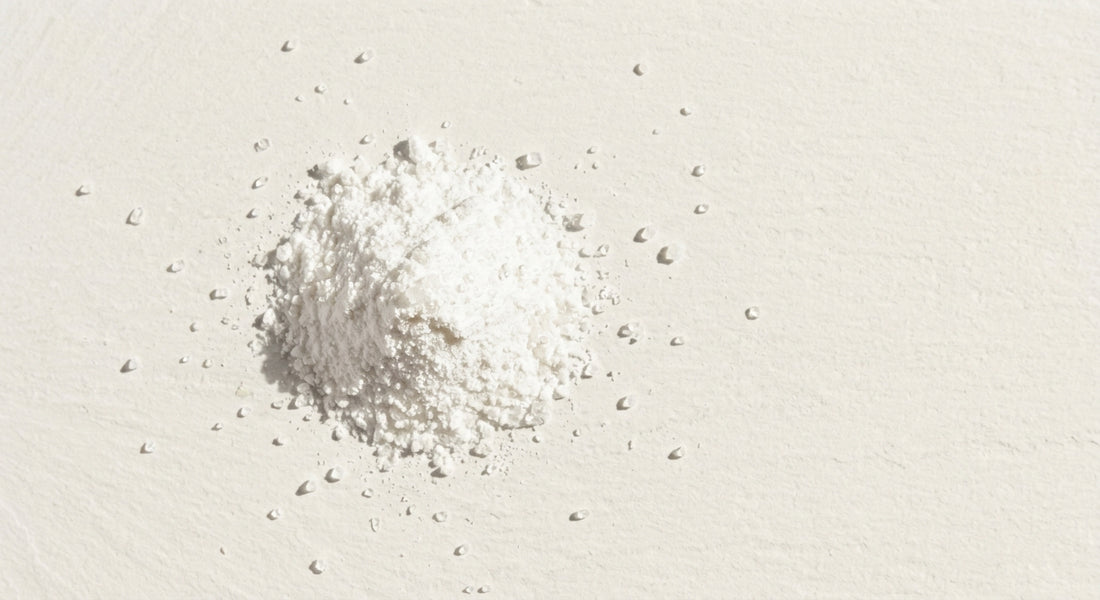 THCA powder for sale fine white hemp isolate crystals on white surface Hurcann