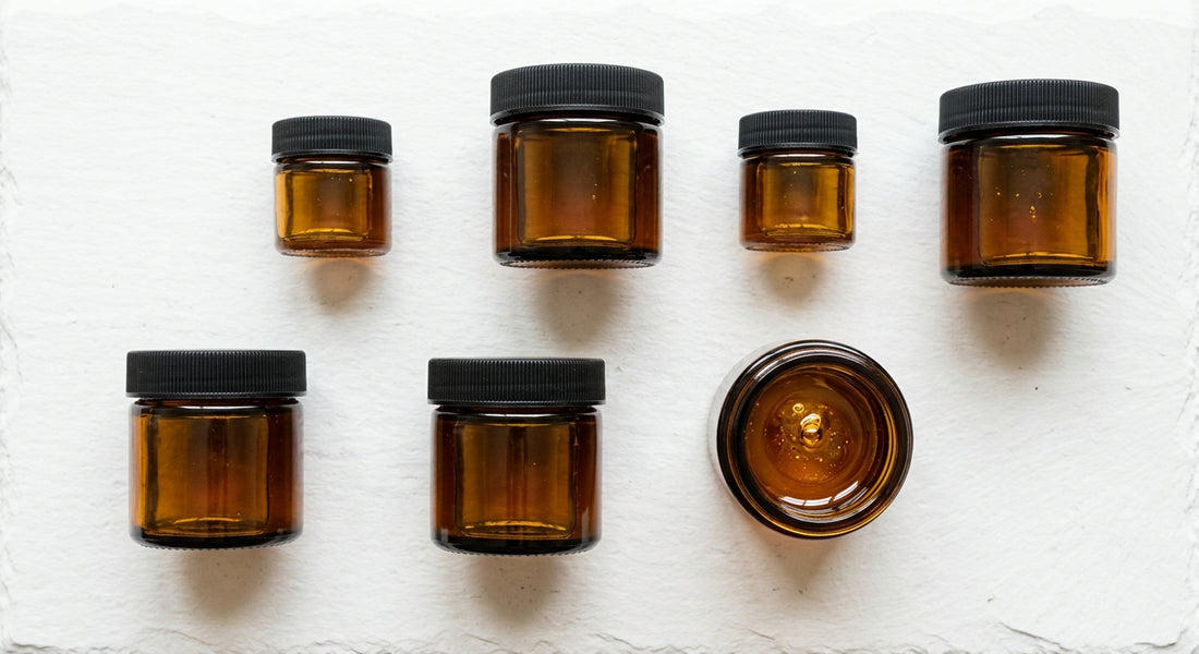 CBD distillate amber oil in glass jars flat lay wholesale Hurcann 2026