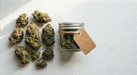 gifting compliant CBD hemp flower buds in glass jar with kraft paper tag 2026