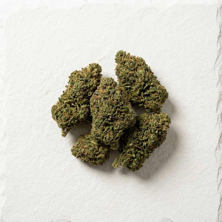 Premium Delta-8 THC hemp flower buds displayed on dark slate surface for wholesale distribution