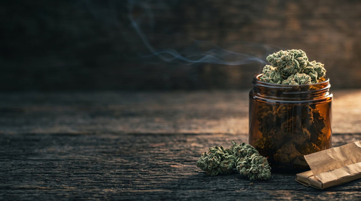 Frosty THCA hemp flower in an amber jar on dark wood