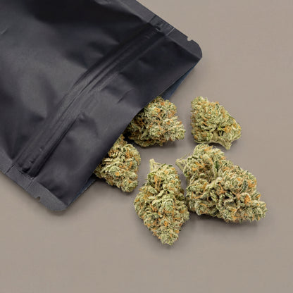 White Widow CBD flower displayed alongside protective packaging used for storage and transport. This packaging helps preserve freshness, aroma and overall product integrity.