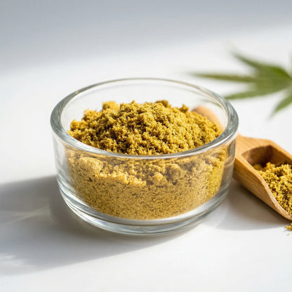 CBD kief powder in a glass bowl with wooden scoop and hemp leaf — premium dry-sift hemp-derived CBD kief" | Hurcann