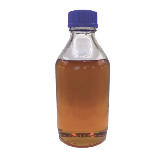 Close-up of Delta-8 amber distillate in a glass jar, showcasing its thick, golden-amber consistency with high purity and potency for dabbing, vaping, or infusion.