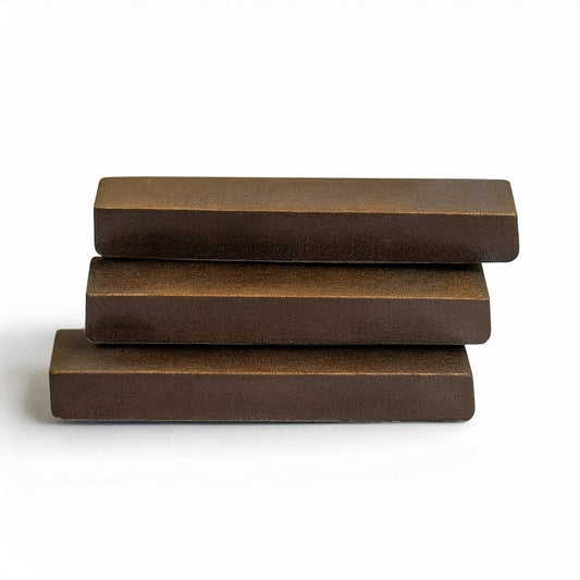 Close-up of Delta-8 THC Moroccan brick hash, showcasing its dense, golden-brown texture with a smooth, pliable consistency for potent effects and traditional hash smoking | Hurcann