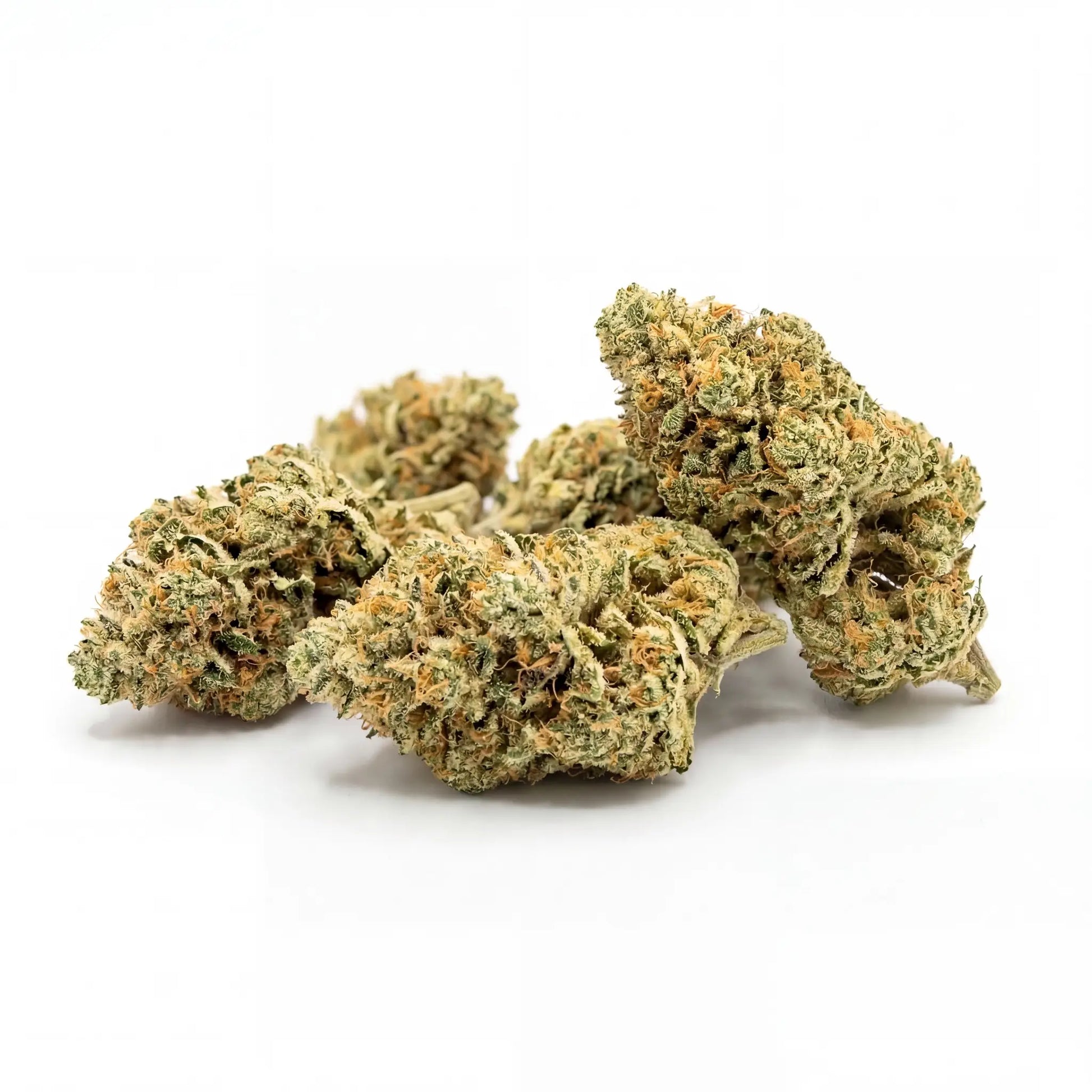 Cluster of Ice Cream Cake CBD hemp flower buds on a white background, showing compact olive-green structure coated in a thick cream-white trichome layer with bright orange pistils throughout | Hurcann