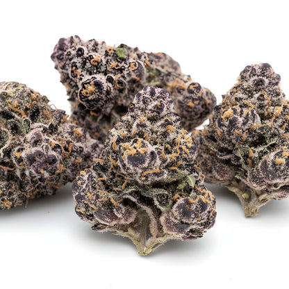 Close up zoom image of Jealousy THCA flower AA grade, highlighting dense trichome coverage, purple hues, and premium indoor cure