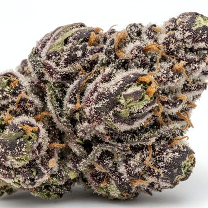 Zoom close-up image of Grape Pie THCA hemp flower AA grade, highlighting thick trichome coverage and resin-rich bud surface