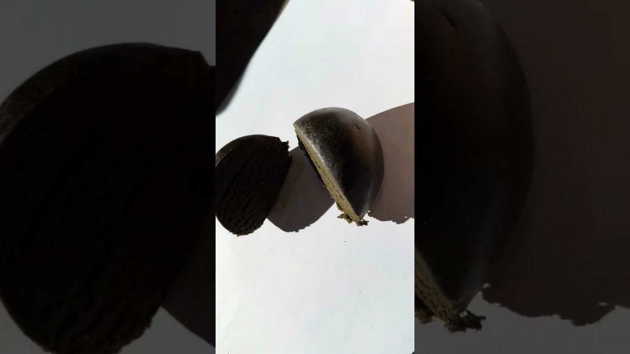 Load video: Close-up of artisan hash ball – solventless premium hash texture and terpene profile breakdown by Hurcann