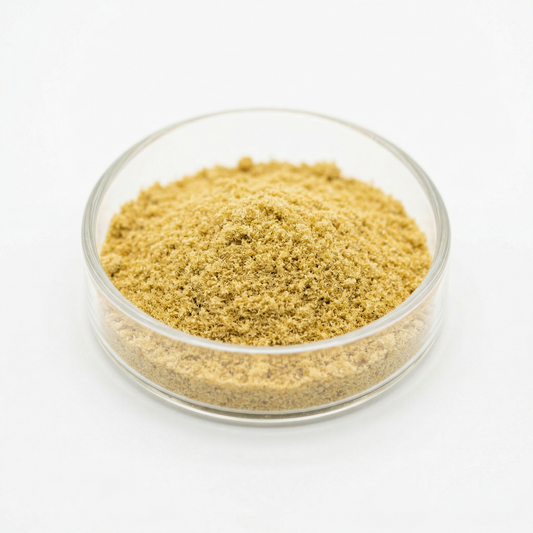 THCA kief powder in a glass dish on white background — golden hemp-derived dry-sift trichomes