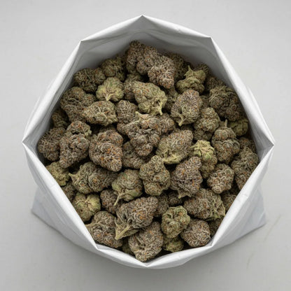 Wholesale photo of Glitter Bomb THCA hemp flower hybrid AAA grade, bulk display of bright green and purple buds coated in thick sparkling trichomes, 29 percent THCA | Hurcann
