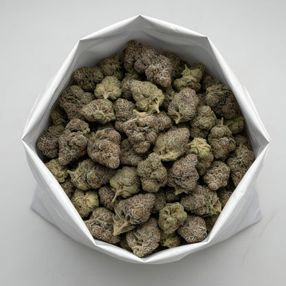 Wholesale photo of Ghosted THCA hemp flower hybrid AAA grade, bulk display of icy white and pale green buds coated in dense trichomes, 31 percent THCA, Ghost OG x Gelato 33 genetics