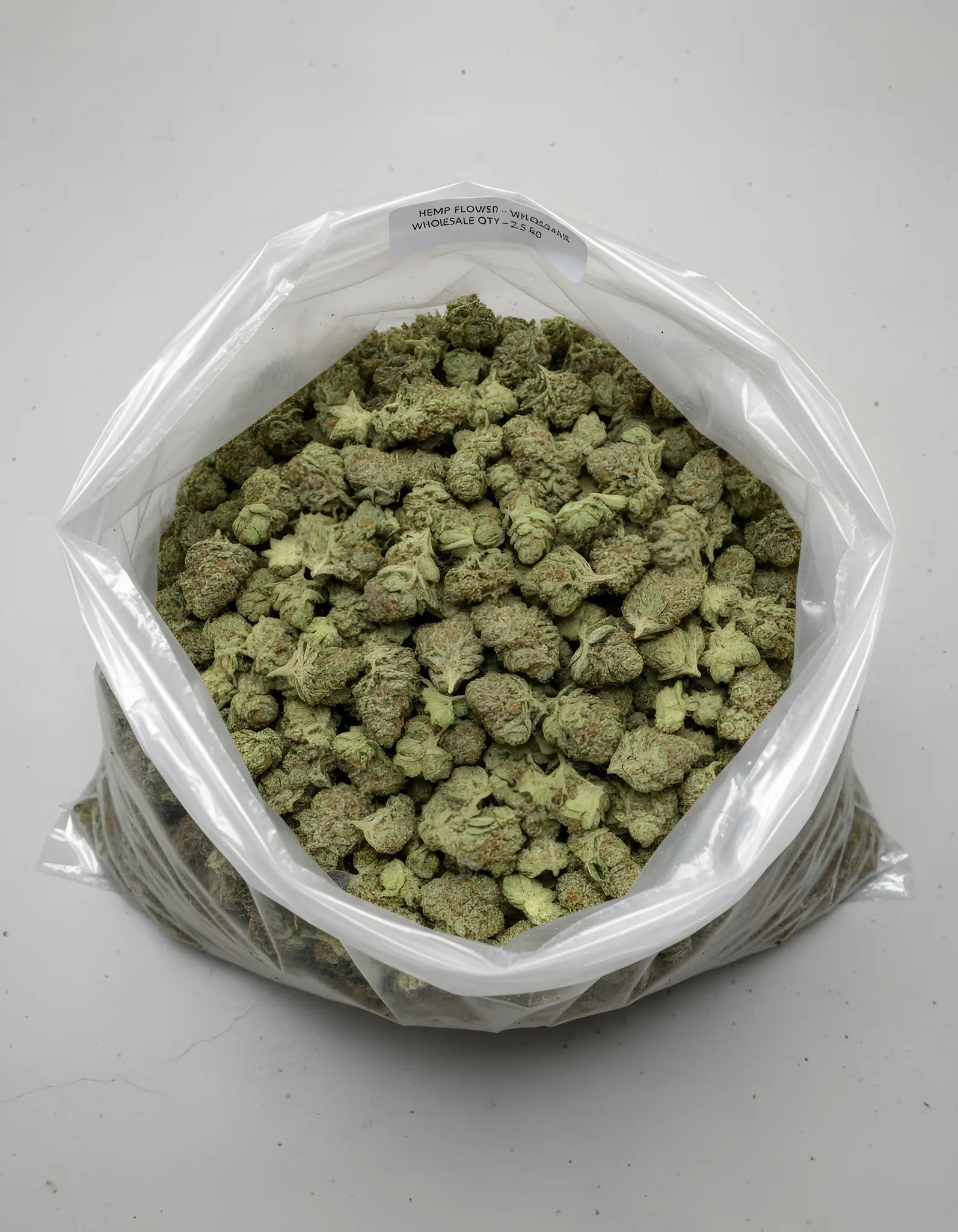 Wholesale photo of Sour Diesel THCA hemp flower hybrid AA grade, bulk display of frosty light green buds with 20 percent THCA