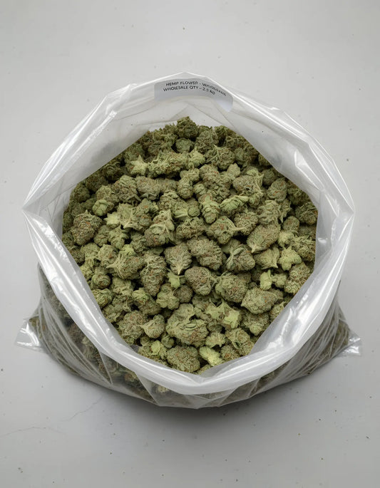 Wholesale photo of Sour Diesel THCA hemp flower hybrid AA grade, bulk display of frosty light green buds with 20 percent THCA