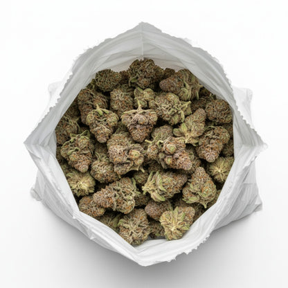 Emerald green buds dusted in shimmering trichomes with fine red pistils throughout.