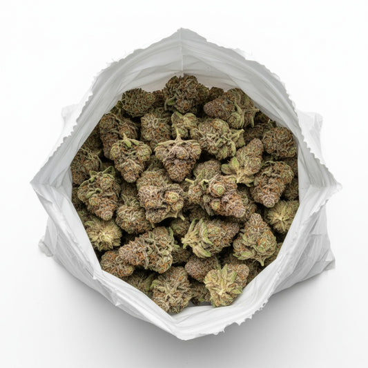 Emerald green buds dusted in shimmering trichomes with fine red pistils throughout.